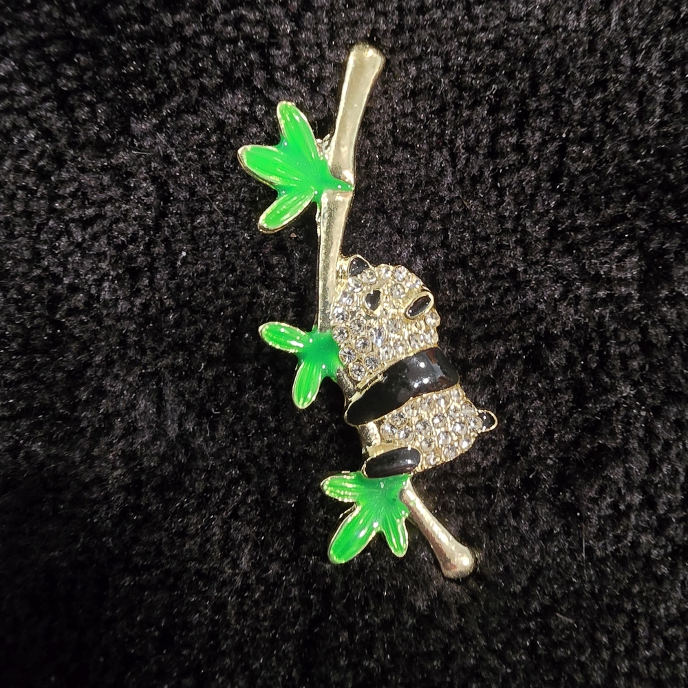 Elegant Panda Brooch with Green Leaves